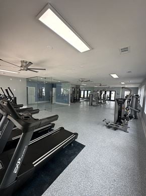 Tampa apartment for rent - a gym with treadmills and other exercise equipment in a building
